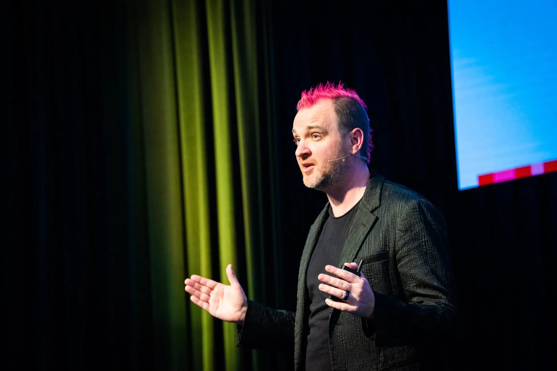 Dom Thurbon speaking on stage